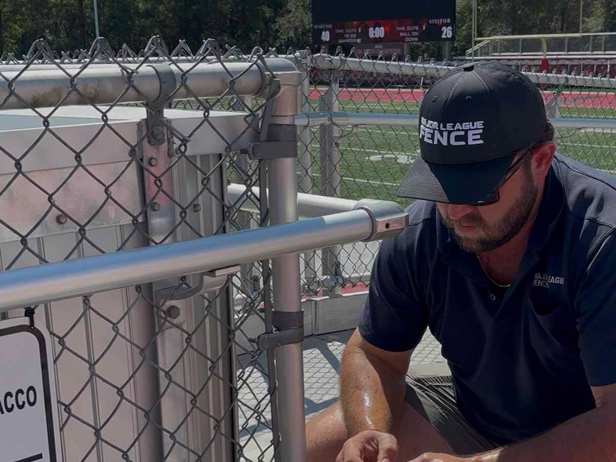 Major League Fence installing a chain link fence in Mobile Alabama for a sports field