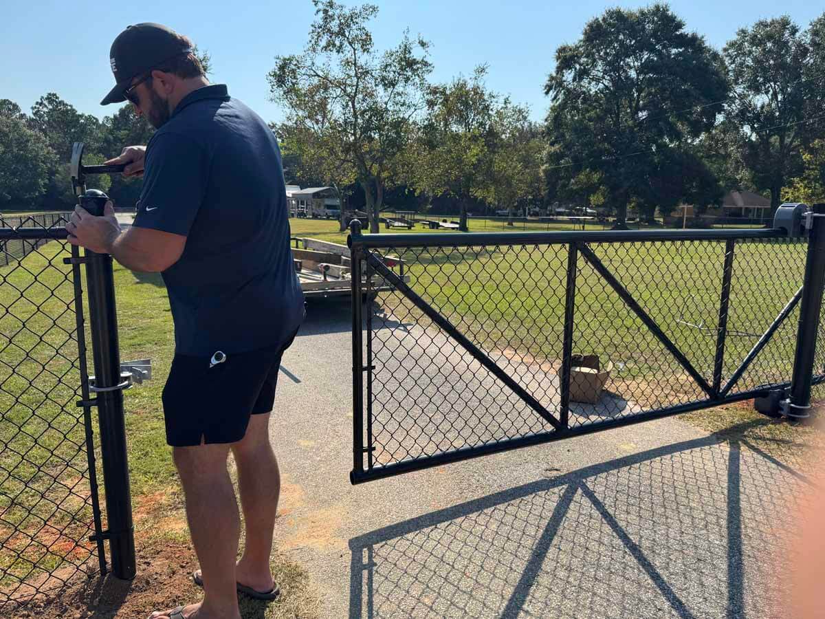 Major League Fence in Mobile Alabama installing a heavy duty chain link sliding gate